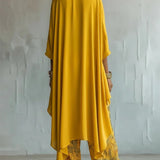 Completo donna stampato con top asimmetrico e pantaloni larghi