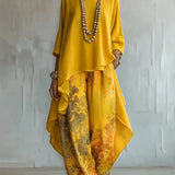 Completo donna stampato con top asimmetrico e pantaloni larghi